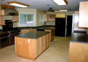 Large Kitchen with Maui Corian Countertops and Island
