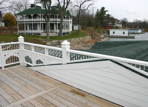 Boathouse with Gingerbread on Wellesley Island - fence over rooftop