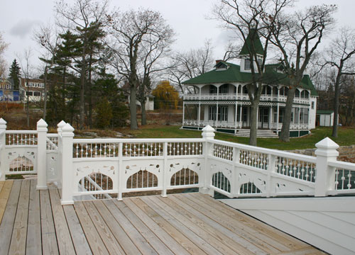 Boathouse with Gingerbread on Wellesley Island - home in background